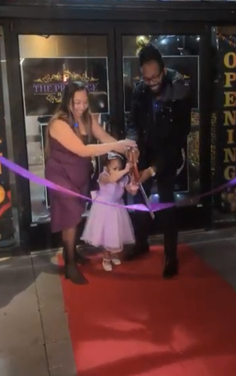 Family ribbon cutting