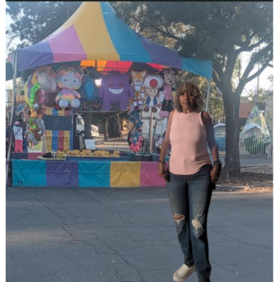 Me in front of stuffed animals booth