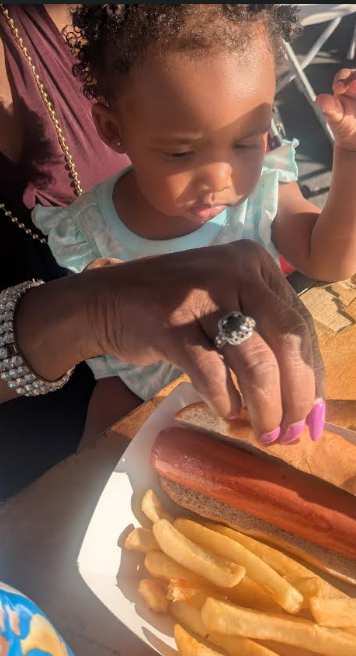 baby eating hot dog